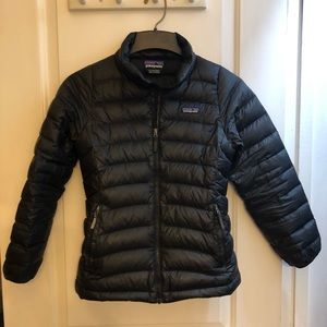Black puffy girl’s Patagonia winter jacket